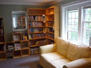 A cozy room with kids books and couch at Park Street Books (photo by Eric)