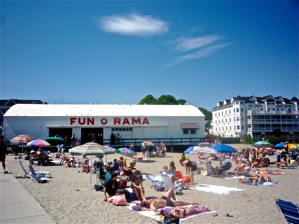 Photo of sandy beach and arcades at Short Sands Beach
