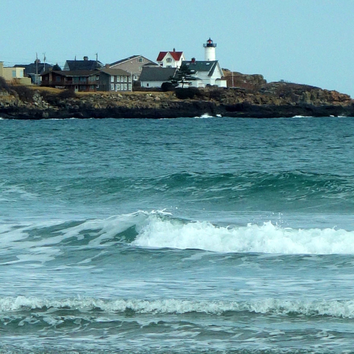 A view of Nubble Lighthouse from Long Sands Beach in York, Maine.