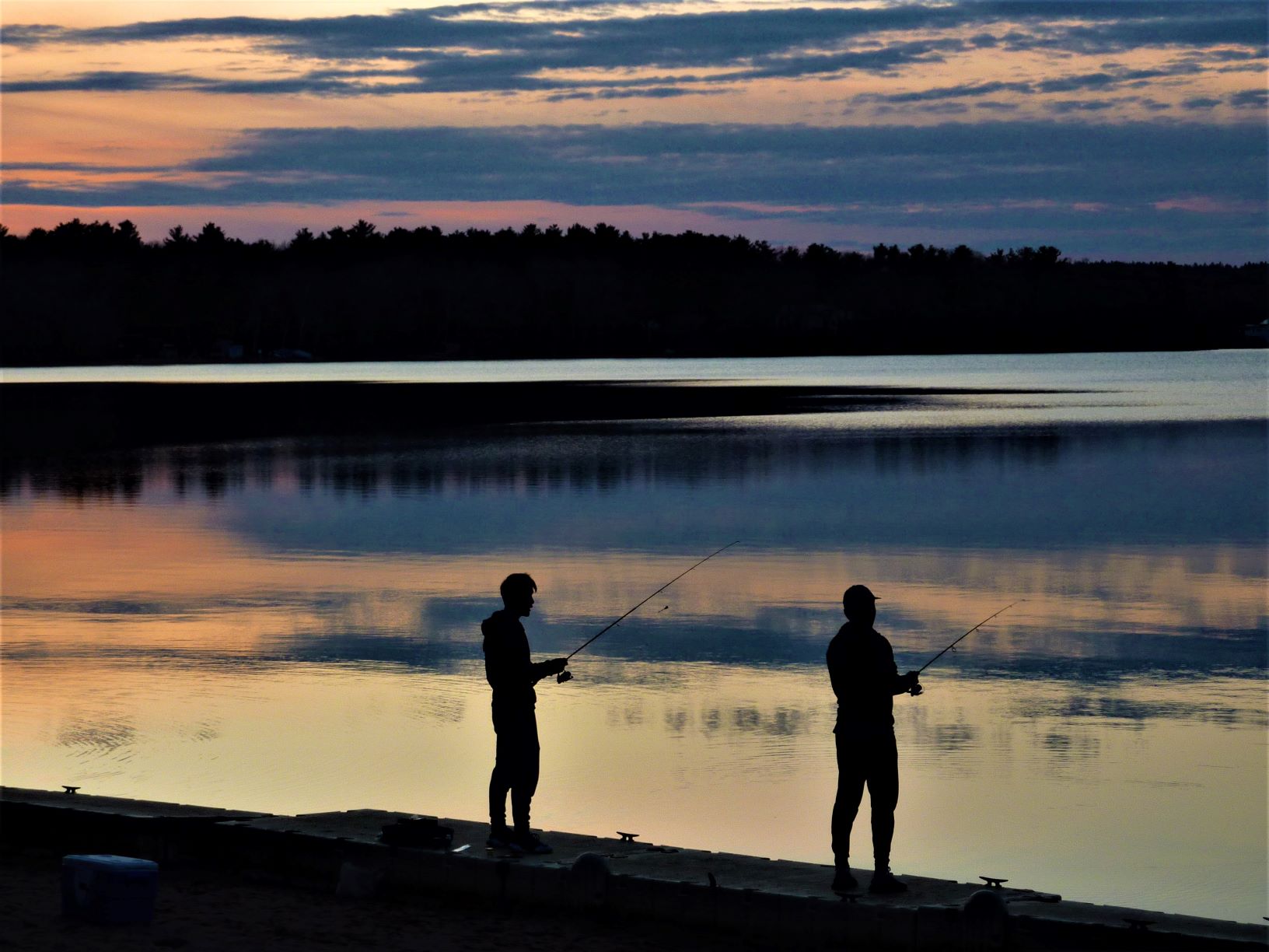 Sunset fishing at Lake Massapoag in Sharon, Massachusetts.