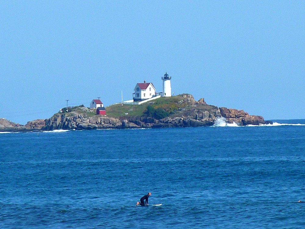 View of Nubble Lighthouse. from Long Sands Avenue in York Beach, Maine.