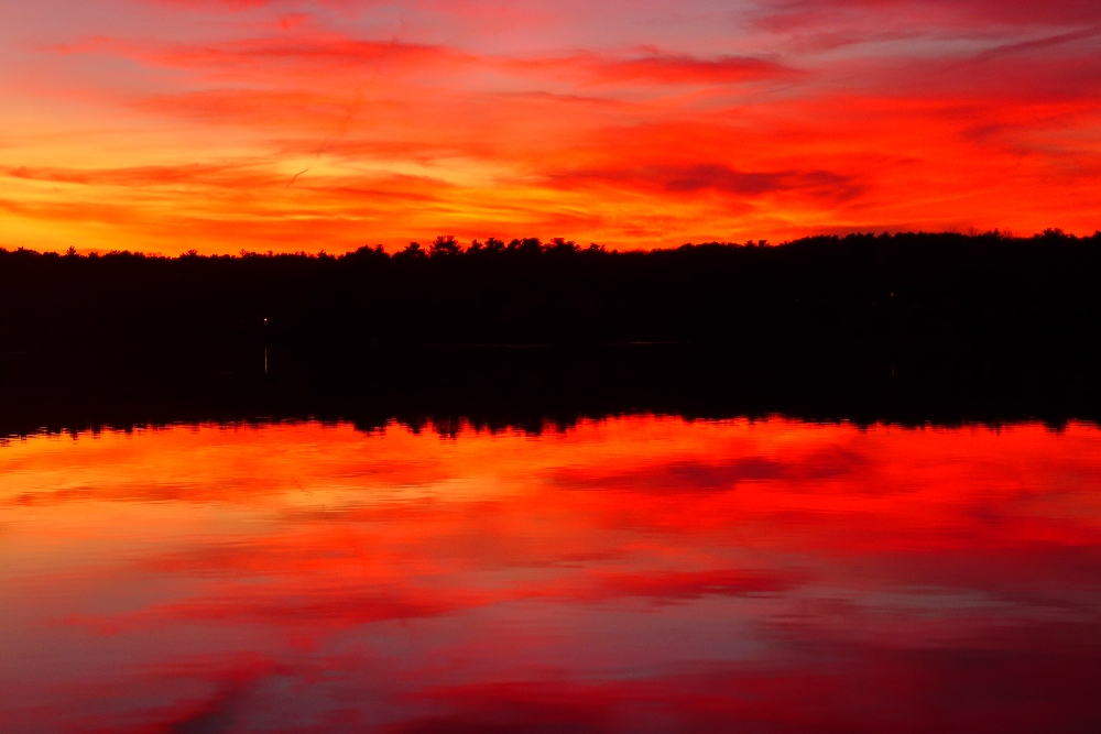 Orange sunset at Willett Pond in Walpole, Mass.