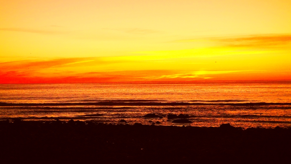 Panoramic sunrise of Long Sands Beach in York Beach, Maine