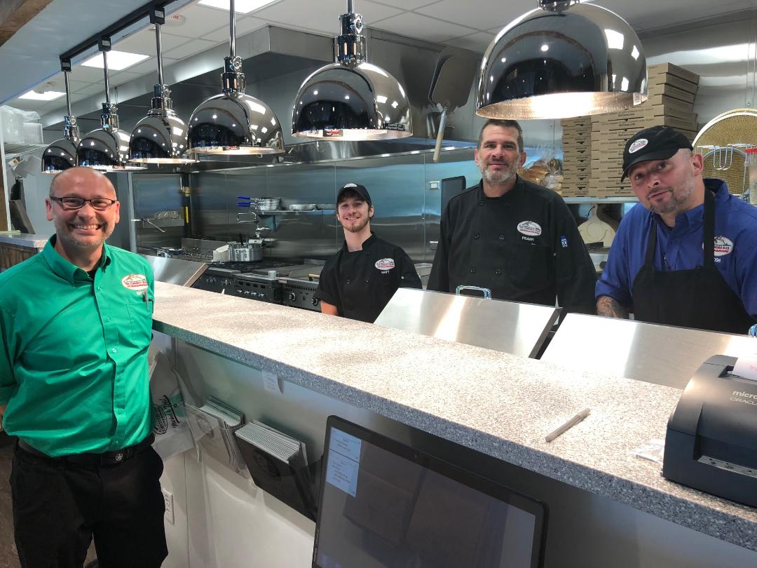 CMR Millyard manager Eric Parent and his team of experienced chefs take great pride in quickly preparing outstanding meal at The Common Man Roadside Millyard in Manchester, N.H.