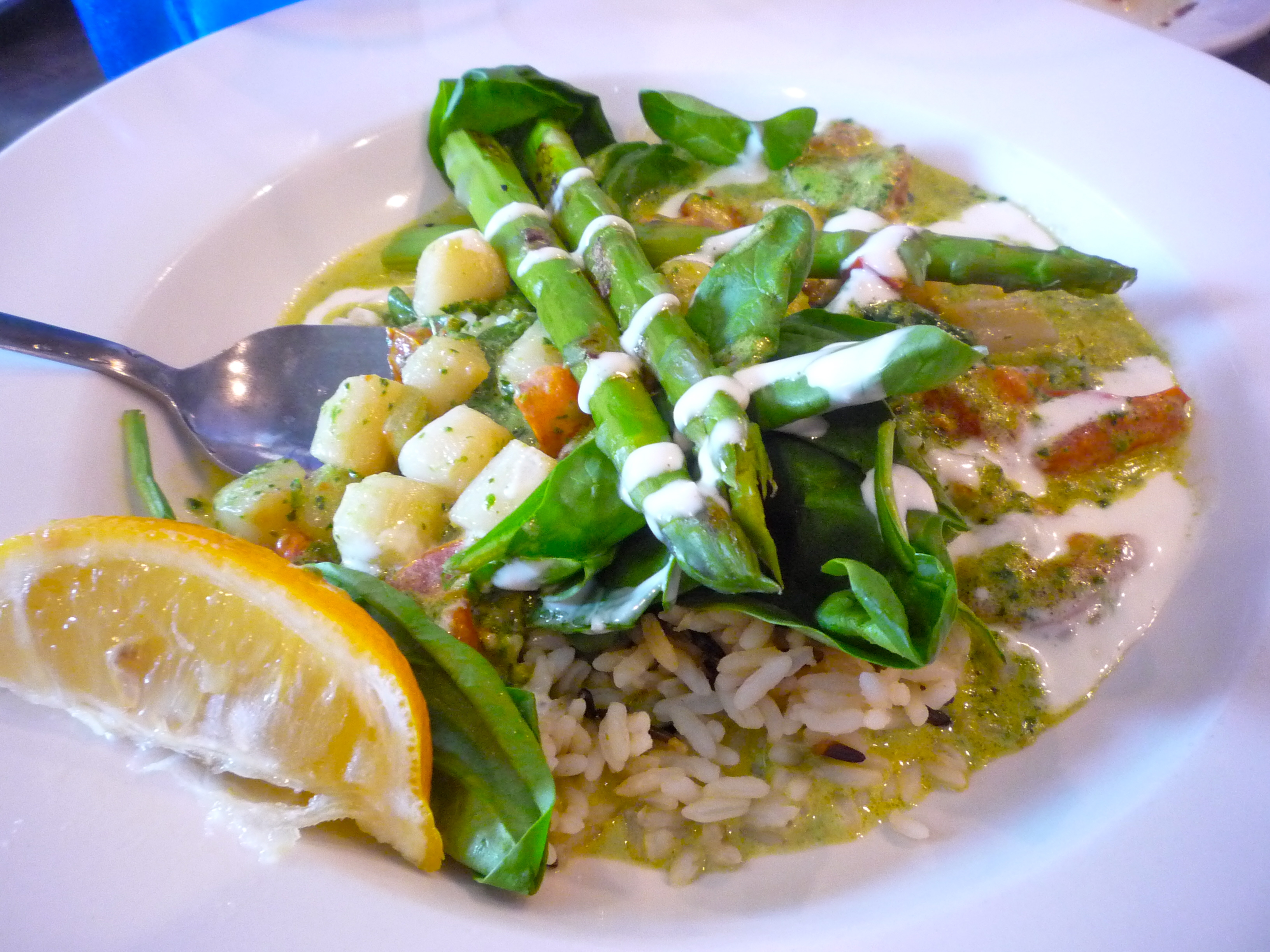 Picture of bay scallops in a pesto cream sauce with asparagus and risotto from Elisabeth's in Fairhaven MA